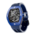 TSAR BOMBA Atomic automatic-skeleton-tonneau-men-watch-TB8218DF- Dynamic fluororubber bezel and blue strap, Left three-quarter-view; Features a dynamic fluororubber bezel（Features numerical markers at the 12, 3, 6, and 9 o'clock positions.） and an interchangeable fluoro-rubber strap. It utilizes TSAR BOMBA’s patented technology, allowing for the tool-free, rapid swapping of the strap, bezel, and crown. Since your watch can change its style, why buy another one?