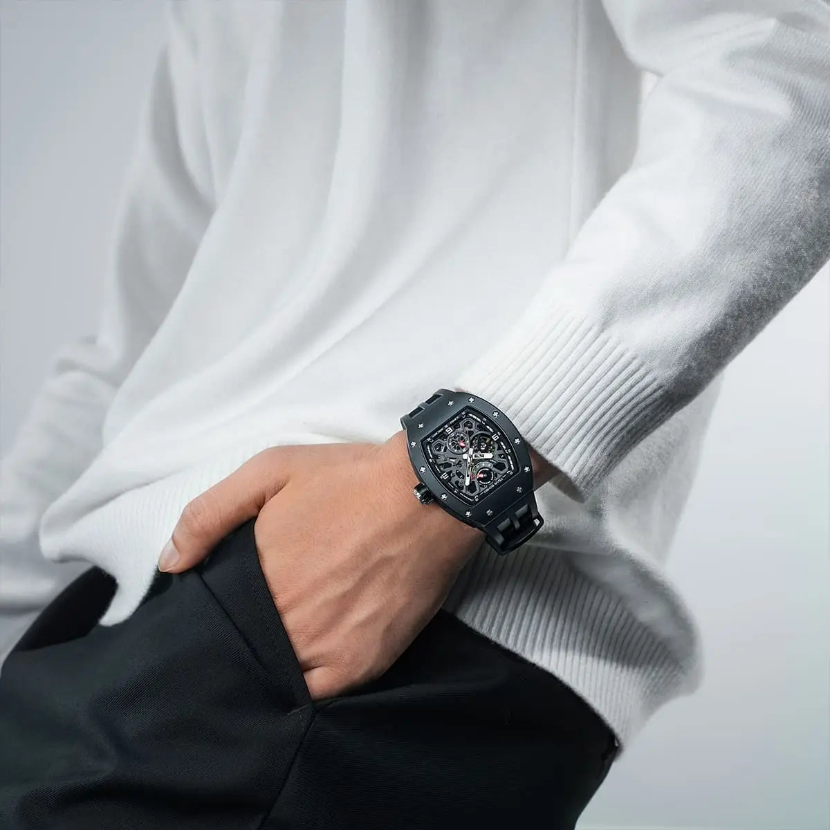 TSAR BOMBA Elemental TB8212 Skeleton Automatic Mechanical Watch. Powered by a Seiko Epson automatic movement, the full ceramic case is lightweight, skin-friendly.  It features Grade A luminescent coating, a scratch-resistant sapphire crystal, and a fluororubber strap. Water-resistant to 50 meters (5 ATM).--Model wearing display