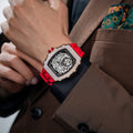 Close-up of a model wearing the TSAR BOMBA Elemental TB8208D men’s Red tonneau watch with a gold-tone stainless steel case and cubic zirconia bezel and skeleton dial.