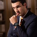 Close-up of a model wearing the TSAR BOMBA Reactor TB8213 Carbon Fiber Automatic Interchangeable Men's Watch. Features a black stainless steel case and carbon fiber bezel, powered by a Japanese automatic movement. Top dial: minutes; central dial: seconds. Bottom main display: hour hand = pointer reading + central window reading. The TB8213 utilizes the TSAR BOMBA interchangeable module system, allowing for quick and tool-free changes of the strap, bezel, and crown.