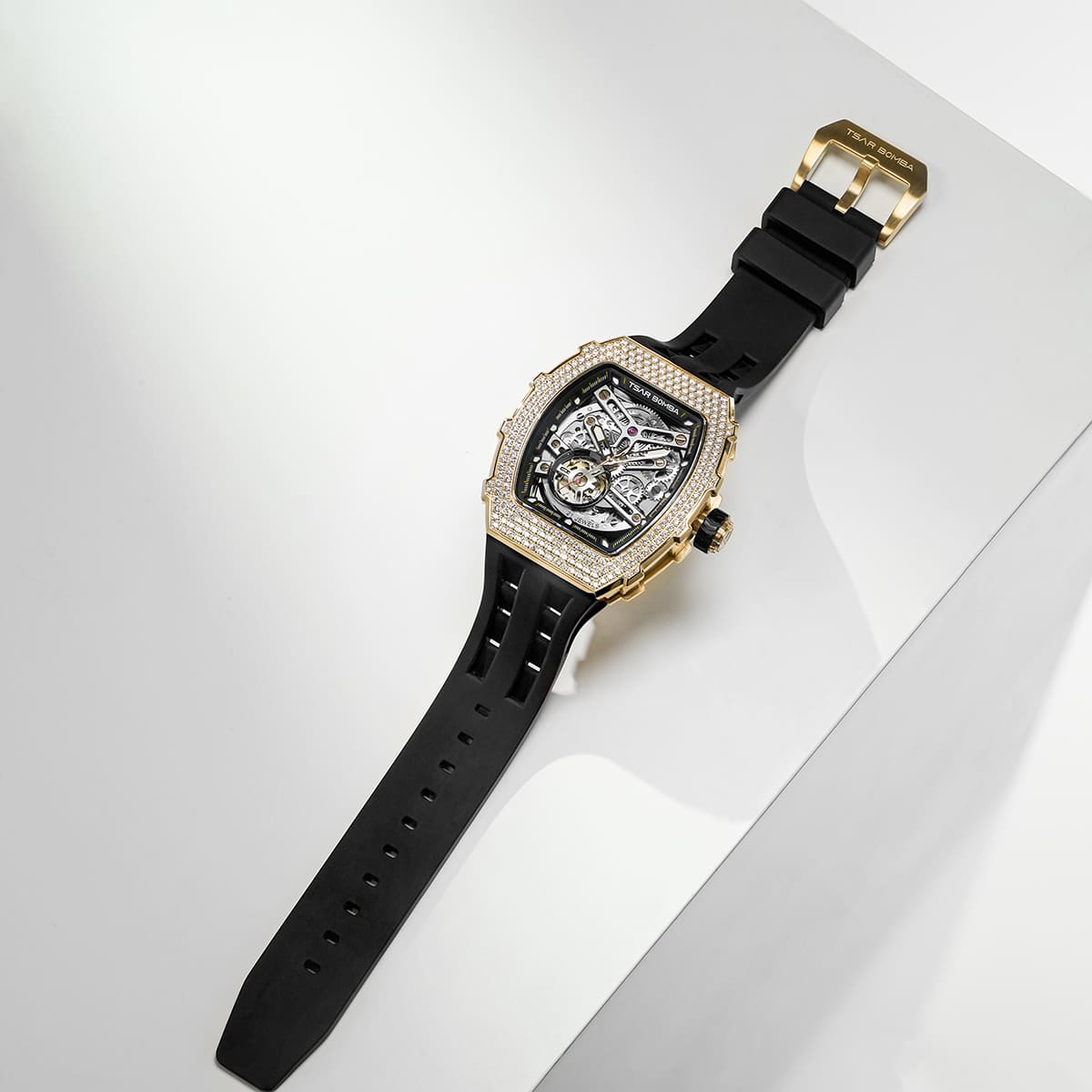 TSAR BOMBA Elemental TB8208D men’s Black tonneau watch with a gold-tone stainless steel case and cubic zirconia bezel and skeleton dial.