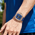  TSAR BOMBA Elemental TB8211Q Stainless Steel Tonneau Chronograph Watch. Features a stainless steel case and a precision-machined quartz movement. The textured dial integrates date display and chronograph function. A 1/20th-second counter is located at 12 o'clock, the date display at 3 o'clock, the hour/minute counter at 6 o'clock, and the seconds counter at 9 o'clock.--Model wearing display