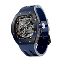 TSAR BOMBA Atomic automatic-skeleton-tonneau-men-watch-TB8218cf- Carbon fiber blue bezel and blue strap, Left three-quarter-view; Features a carbon fiber bezel and an interchangeable fluoro-rubber strap. It utilizes TSAR BOMBA’s patented technology, allowing for the tool-free, rapid swapping of the strap, bezel, and crown. Since your watch can change its style, why buy another one?